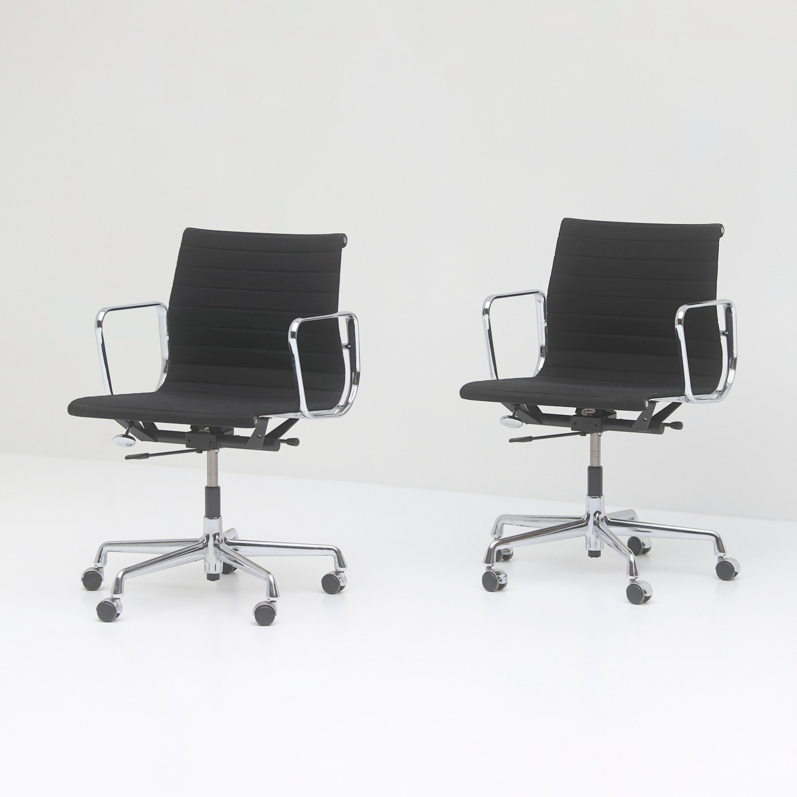 Two Eames office desk chairs ea117