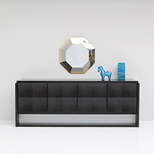 Sculptural credenza with black ebonized body and solid oak doors