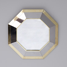 Decorative 1980s brass mirror in a hexagonal form 