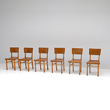Six decorative restaurant chairs